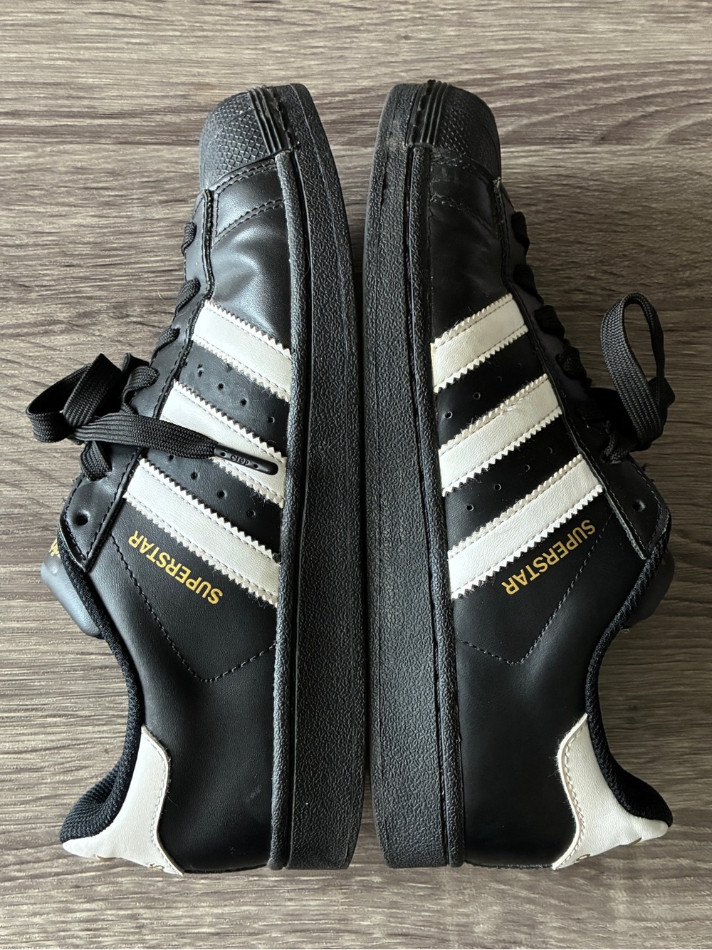 Adidas Superstar Foundation Black/ white/ gold accent low top shell toe sneakers